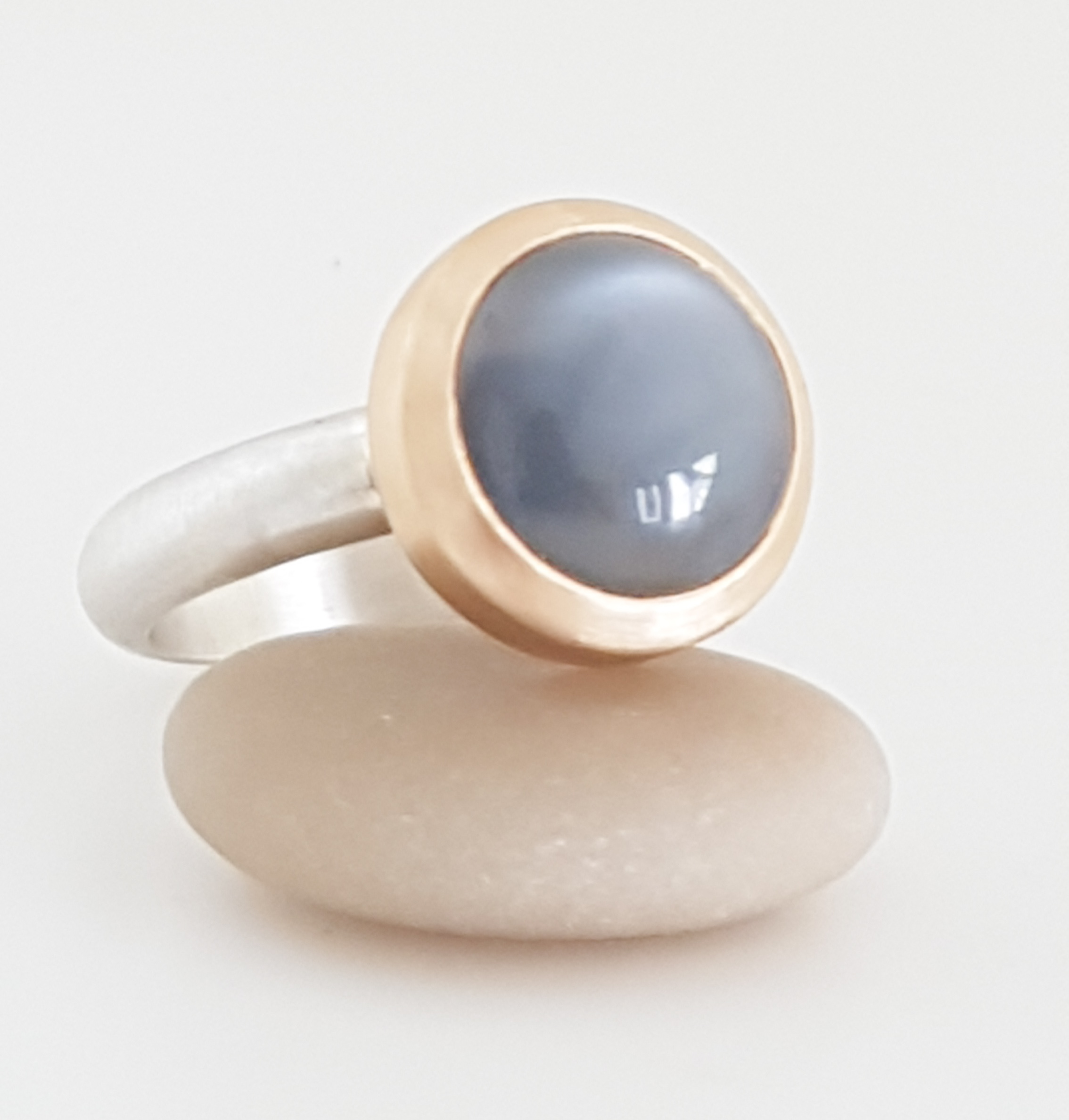 Golden silver ring and grey moonstone